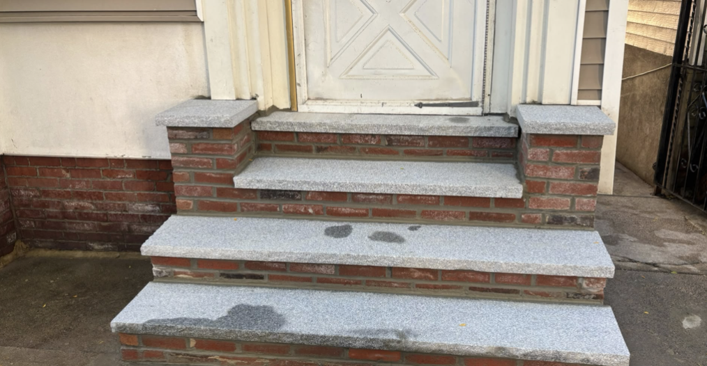 New granite treads set, steps ground and repointed — East Boston, MA